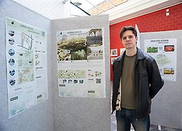 Lukas Svensson standing infront of the sketches